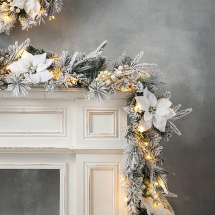Glitzhome 9ft Pre-Lit Snow Flocked Greenery Pine Poinsettia Christmas Garland, with 50 Warm White Lights with Timer