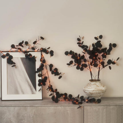 LITBLOOM Halloween Garland with Lights 6FT Battery Operated with Timer, Lighted Black Eucalyptus Garland with 96 Orange and Warm White Lights 10 Functions for Fireplace Table Fall Halloween Decoration