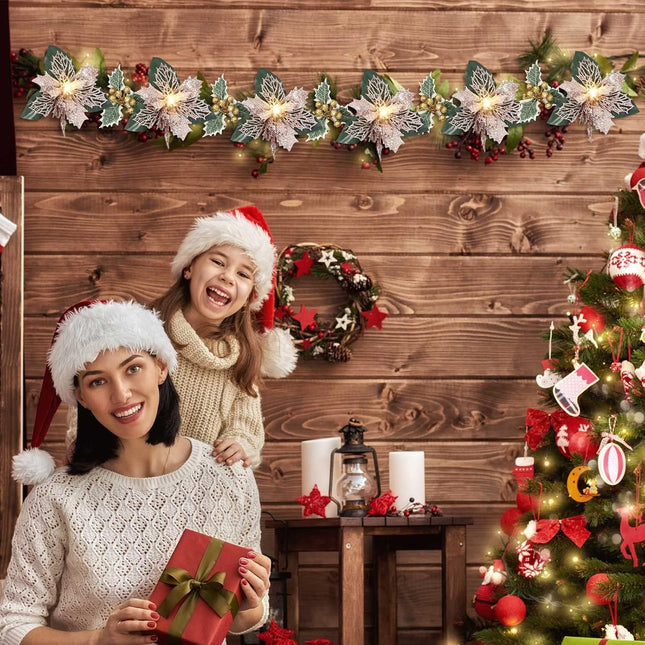 Jexine 2 Pcs Christmas Glitter Artificial Poinsettia Garland 6.5 ft 10 LEDs Faux Flower Xmas String Lights Poinsettia Garland with Lights Gold Berries Holly Leaves for Indoor Outdoor Decor