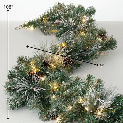 Sullivans 9' Prelit Christmas Garland, Christmas Decor, Garland Christmas Decorations, Artificial Flocked Pine Garland For Mantle with Lights, Pinecones, Battery Timer, and Gold Accents, Holiday Decor