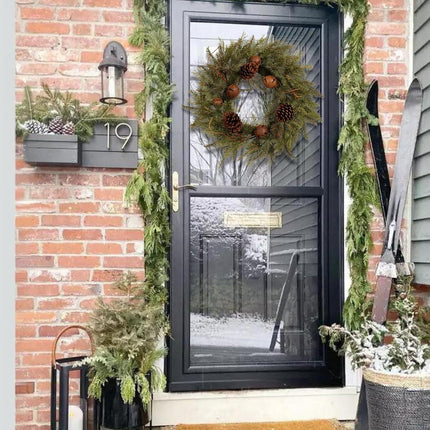 22-Inch Handcrafted Artificial Christmas Wreath with Pinecones, Rust Bell, and Lifelike Pine Branches Winter Holiday Wreath for Front Door and Home Décor, Indoor/Outdoor Seasonal Décor